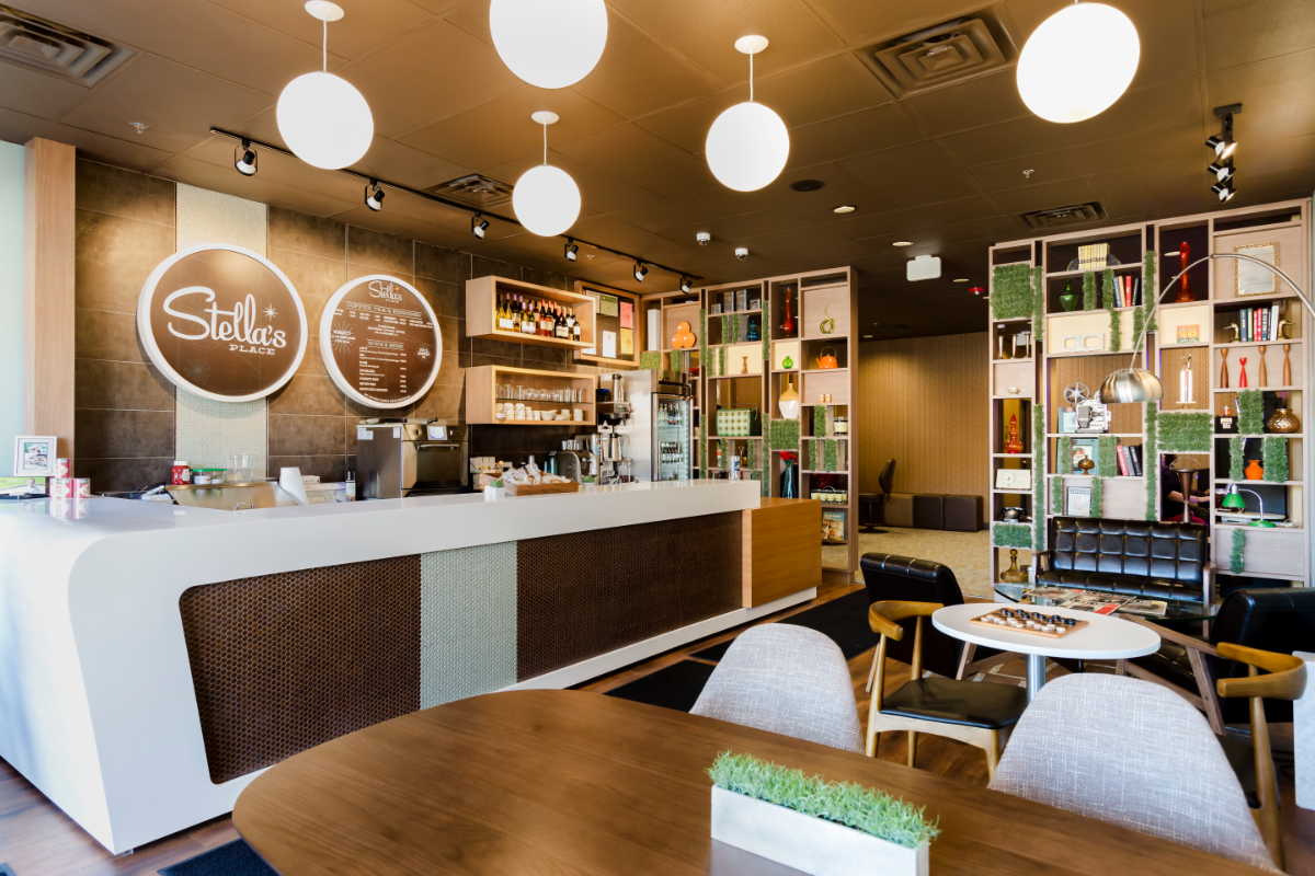 the inside of a stellas restaurant with counters and tables
